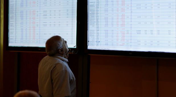 Investors monitor prices at the Iraq Stock Exchange in Baghdad, Iraq, Aug. 2, 2017.