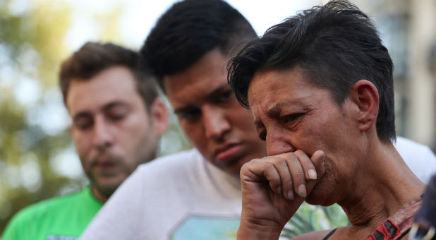 People react in the area where a van crashed into pedestrians at Las Ramblas street in Barcelona, Spain, Aug. 18, 2017.