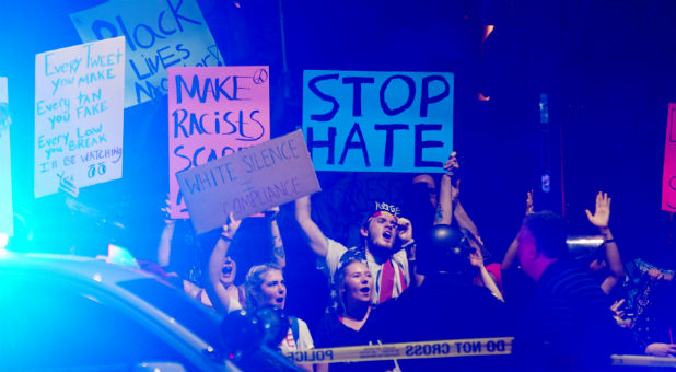 Pro-Trump supporters face off with anti-Trump protesters outside a Donald Trump campaign rally in Phoenix, Arizona, Aug. 22, 2017.