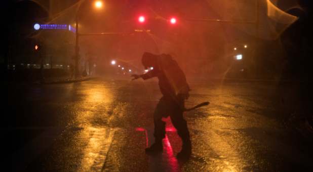 Stewart Adams, of San Marcos, Texas, plays in the winds from Hurricane Harvey in Corpus Christi, Texas, U.S. August 25, 2017.