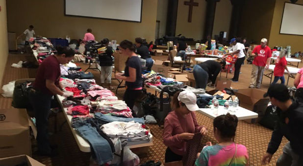 Volunteers sort through donations at Grace Woodlands.