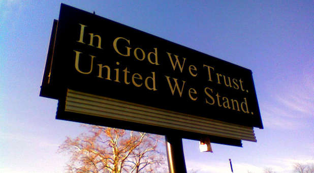 Atheist Group Threatens School District Over Use of ‘In God We Trust’