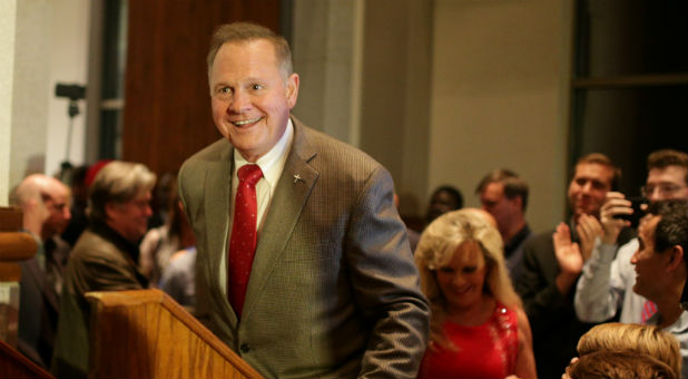 Roy Moore enters the stage to make his victory speech