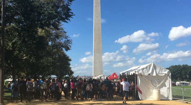 People worship outside the California tent at Awaken the Dawn.