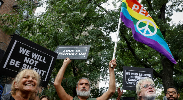 People gather outside the Stonewall Monument in New York City.