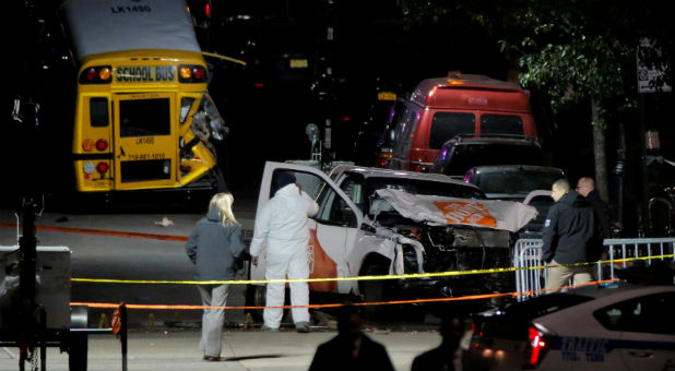 Police investigate a pickup truck used in an attack on the West Side Highway in Manhattan.