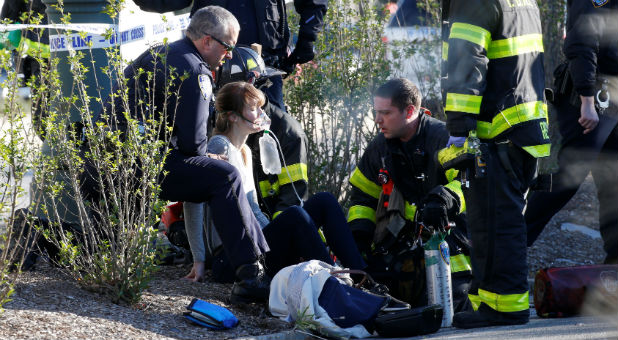 A victim receives aid after she was struck during the recent terror attack.