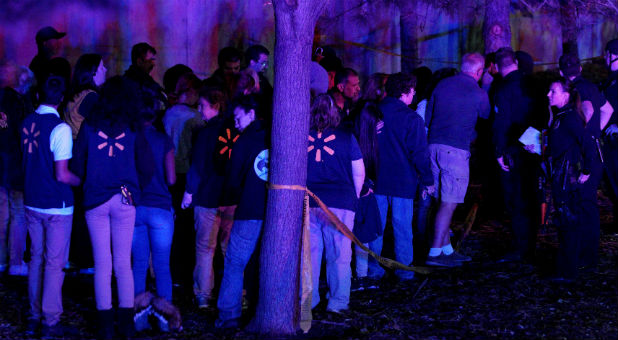 Police interview Walmart employees and shoppers at the scene of a shooting at a Walmart in Thornton, Colorado.