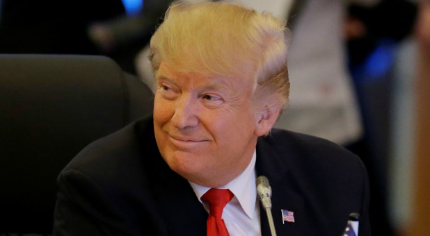 U.S. President Donald Trump smiles.