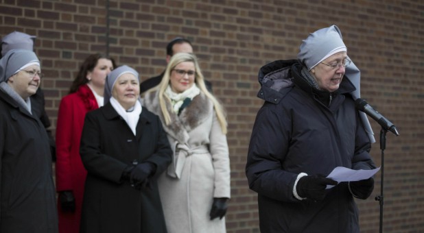 Mother Loraine Maguire gives a statement outside the courthouse.