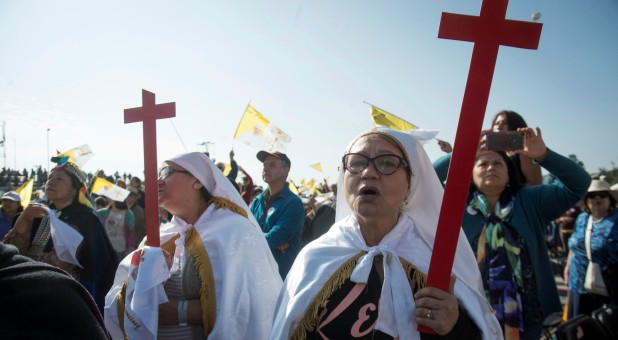 Faithful wait for Pope Francis to lead a mass at park O'Higgins, in Santiago, Chile.