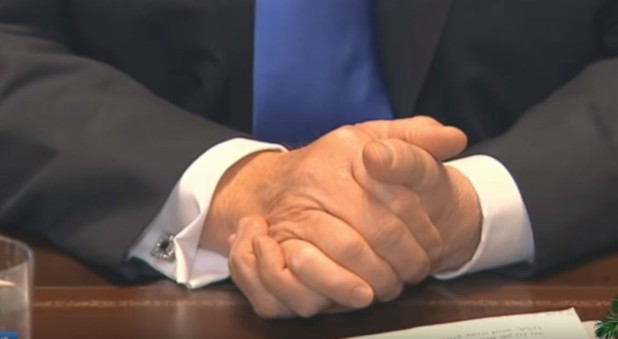 President Trump listens as Ben Carson prays.