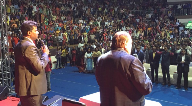 Morris Cerullo, right, preaches in India.