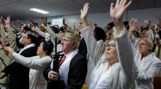 People with their AR-15-style rifles attend a blessing ceremony at the Sanctuary Church in Newfoundland, Pennsylvania.