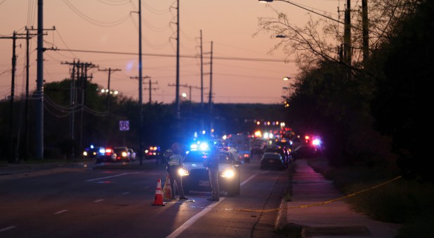 Law enforcement personnel investigate an incident that they said involved an incendiary device in the 9800 block of Brodie Lane in Austin, Texas.