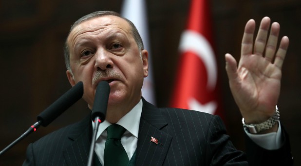 Turkish President Tayyip Erdogan addresses members of parliament from his ruling AK Party (AKP) during a meeting at the Turkish parliament in Ankara, Turkey.