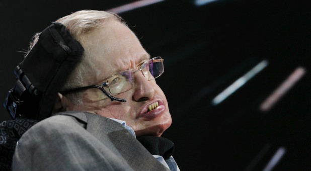 Physicist Stephen Hawking sits on stage during an announcement of the Breakthrough Starshot initiative with investor Yuri Milner in New York, April 12, 2016.