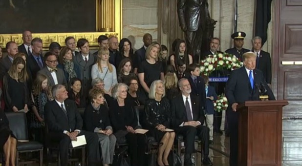 Billy Graham's family, left, with Donald Trump, right.