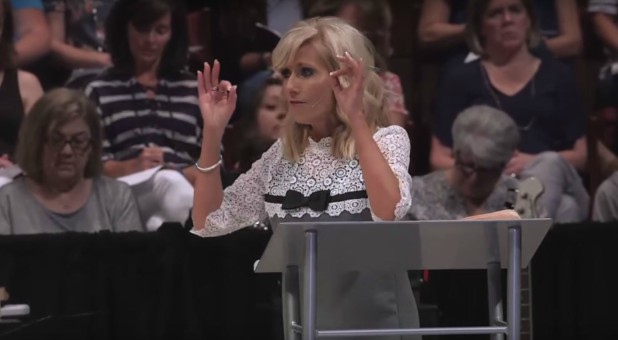 Beth Moore delivers a sermon.