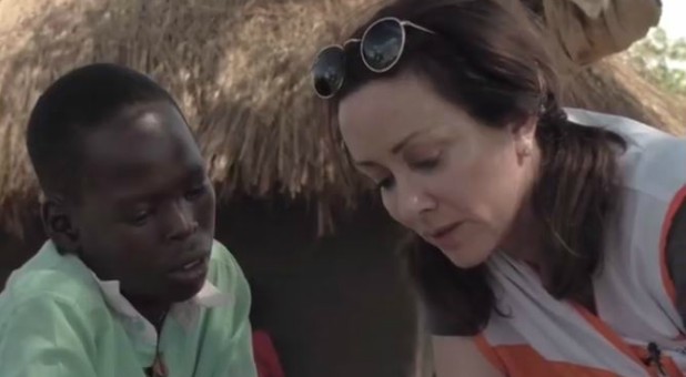 Patricia Heaton, right, reads prayers to Victor.