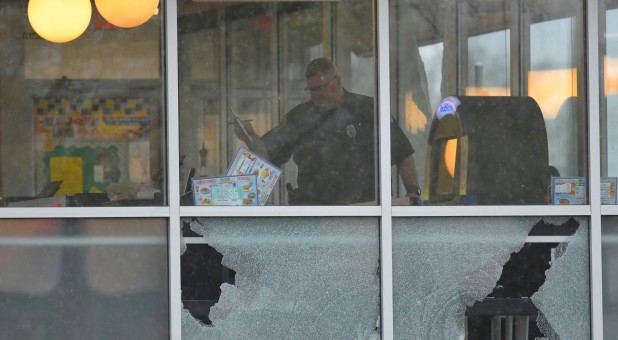 Metro Davidson County Police inspect the scene of a fatal shooting at a Waffle House restaurant near Nashville, Tennessee.