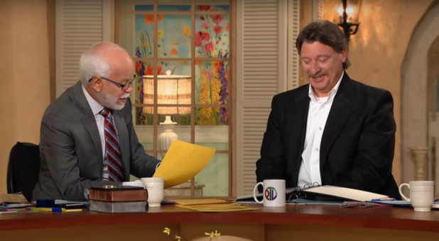 Jim Bakker, left, talks with Mark Taylor, right.