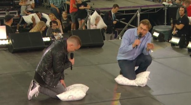 Nick Hall and Mike Lindell pray after a pillow fight.