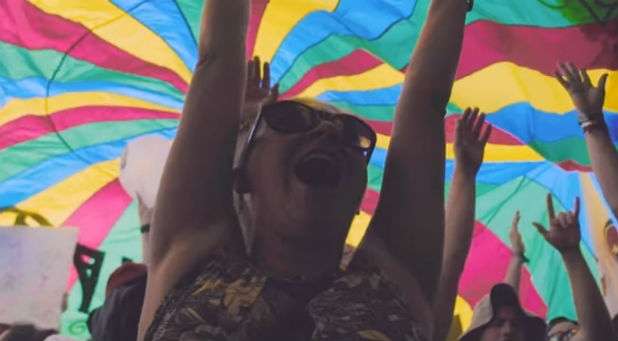 A girl participates in Bonnaroo.