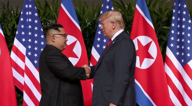 President Donald Trump shakes hands with North Korean leader Kim Jong Un at the Capella Hotel on Sentosa island in Singapore.