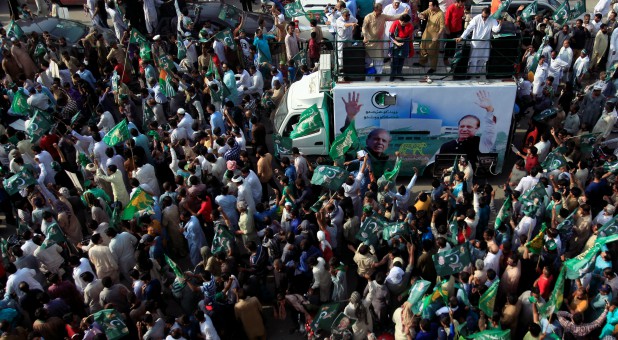 Supporters of the Pakistan Muslim League - Nawaz (PML-N) chant and march towards the airport to welcome ousted Prime Minister Nawaz Sharif and his daughter Maryam, in Lahore, Pakistan.