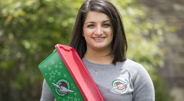 Dania Yadago with an Operation Christmas Child shoebox