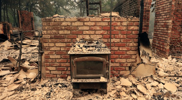 The debris of a burned home is seen after the Carr Fire west of Redding, California.