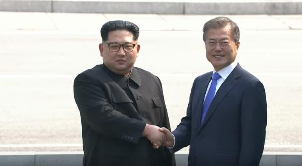 North Korean Supreme Leader Kim Jong-un and South Korean President Moon Jae-in shake hands at a historic summit.