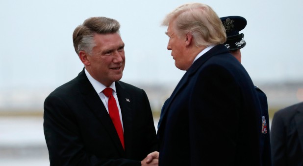 U.S. President Donald Trump greets Mark Harris.