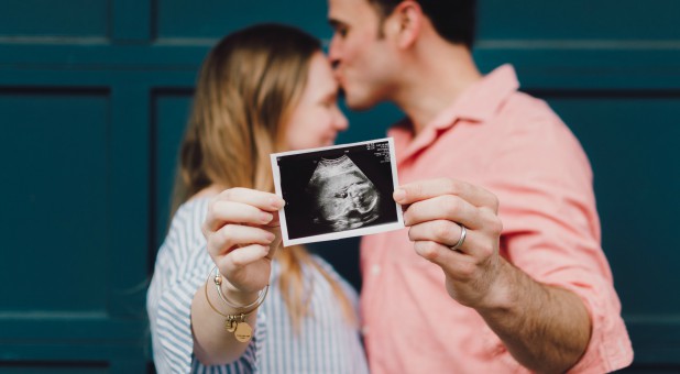 A couple shares their ultrasound.