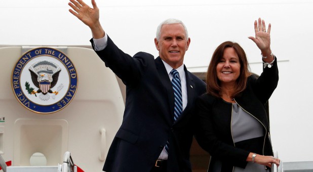 U.S. Vice President Mike Pence and his wife, Karen, wave as they board the Air Force Two at Yokota U.S. Air Force Base in Fussa, on the outskirts of Tokyo, Japan.