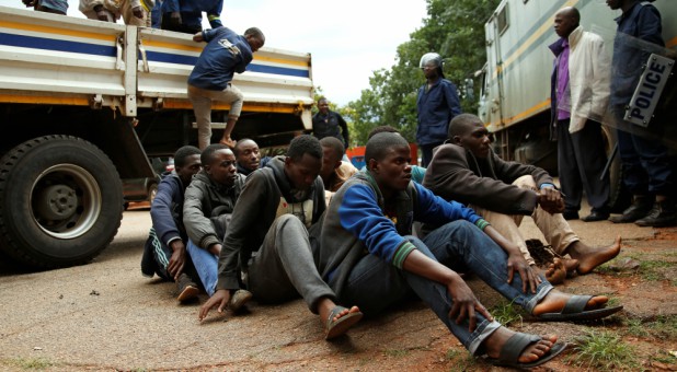 People arrested during protests wait to appear in the Magistrates court in Harare, Zimbabwe.