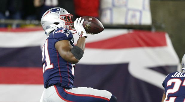 New England Patriots safety Duron Harmon (21) reacts after making an interception.