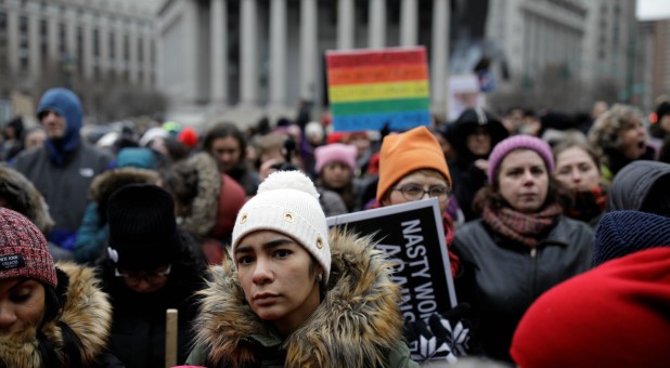 A sea of supporters listen on as Poet Staceyann Chin recites a poem during the Women's March NYC demonstration.