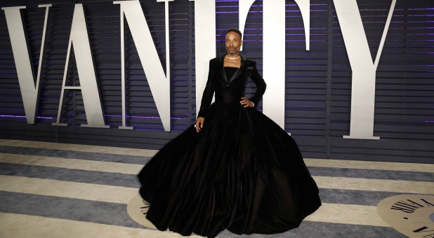 Billy Porter wears a black velvet tuxedo gown by Christian Siriano.