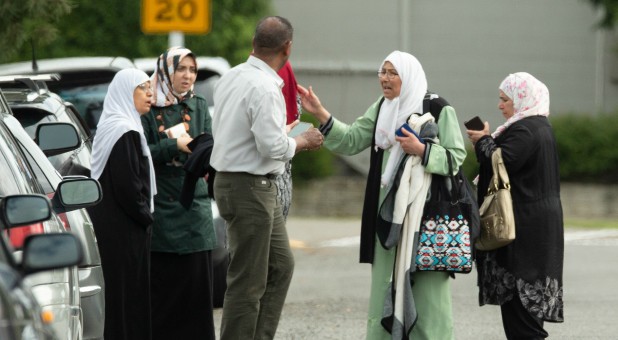 Members of a family react outside the mosque following a shooting at the Al Noor mosque in Christchurch.