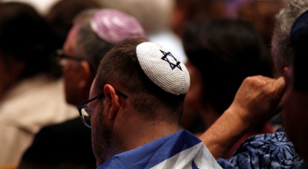 A man mourns the recent synagogue attack in San Diego.