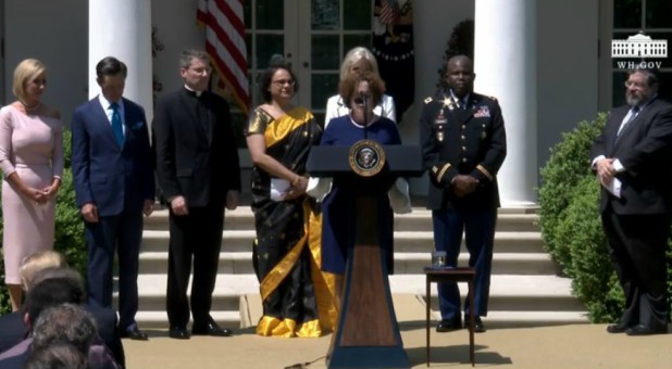 Guests pray in the Rose Garden on the National Day of Prayer.