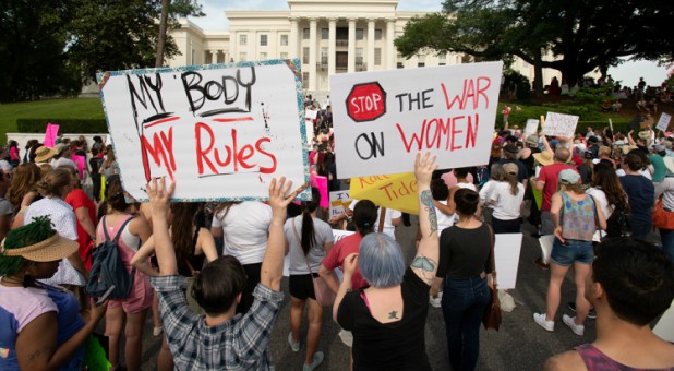 People gather at the Alabama State Capitol during the March for Reproductive Freedom against the state's new abortion law, the Alabama Human Life Protection Act.