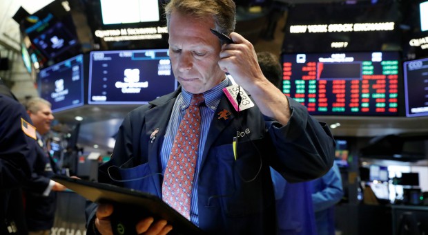 Traders work on the floor of the New York Stock Exchange shortly after the opening bell in New York.