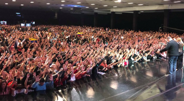 Empowered21 attendees pray and worship in Bogota, Colombia.