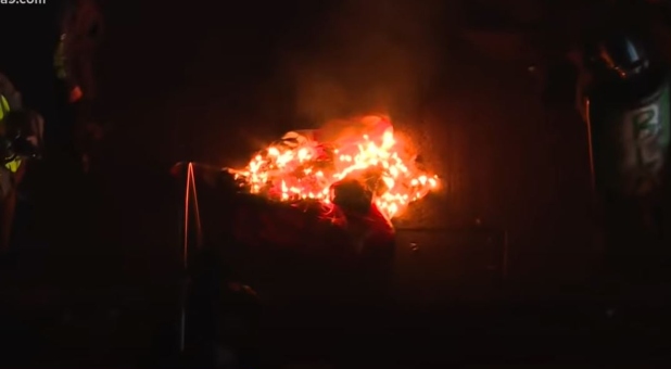 One of multiple flag burnings that took place as anti-Trump protesters clashed with Trump supporters, Washington, D.C., Nov. 14, 2020