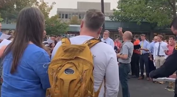 The Moscow, Idaho, hymn sing where three people were arrested.