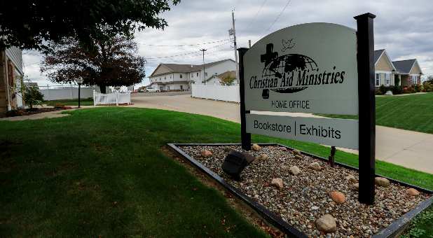 A sign marks the entrance of the home office of Christian Aid Ministries in Millersburg, Ohio, U.S., October 17, 2021.