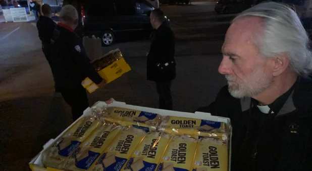 Pastor William Devlin loading food for delivery to refugees in Lyiv, Ukraine.